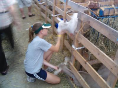 Girl petting a goat.JPG
