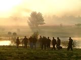 The photographers scurry to find a good position across the dam.