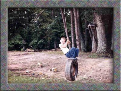 Brian swinging in the tire I put in the tree for him.