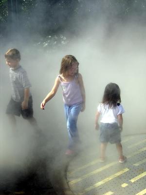 Children frolic in the mist