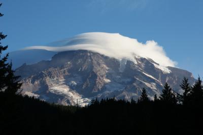 Lenticular cloud covers the top of the mountain