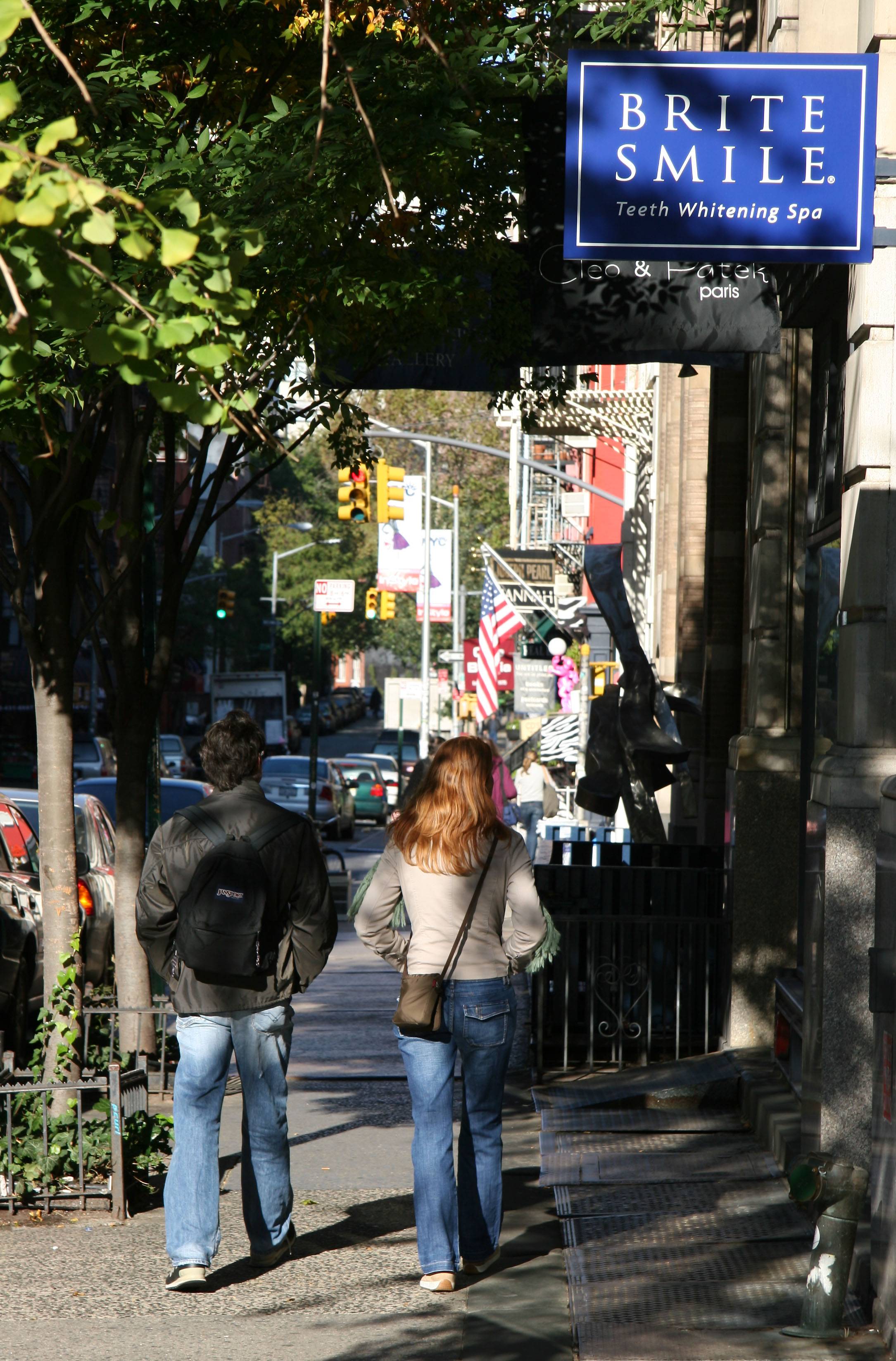 Walking by Brite Smile near West Broadway