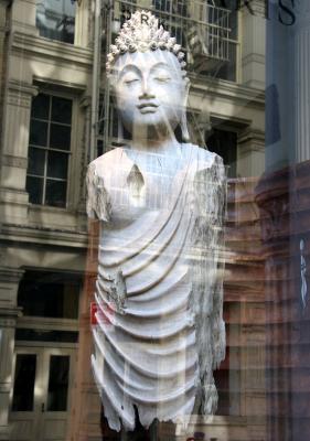 Buddah Reflection in a Clothing Store Window