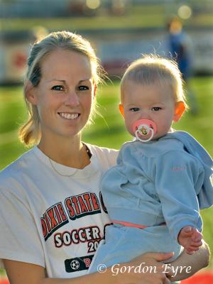Assistant soccer coach with daughter.