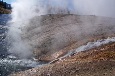 Geyser water flows down to the river