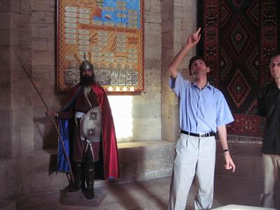 Earnest and learned tour guide, with mannequin sidekick, in Shirvan Shah's Palace.  Baku.