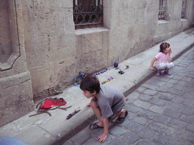 Children in the alleys of the Old City in Baku.  I love the tiny cars all lined up.