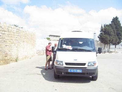 Christopher, Ghengis (pronounced chin-GEESE), and the bus outside of Ateshgah.