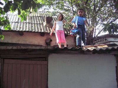 Dancing on the roof, throwing sticks and other trash down and at each other.
