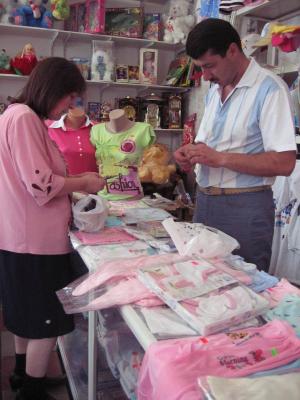 Bahar buys a gift for the new baby.