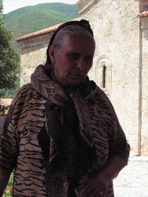 This elder invited us to her home for tea.  Albanian church in the background.  Kish.