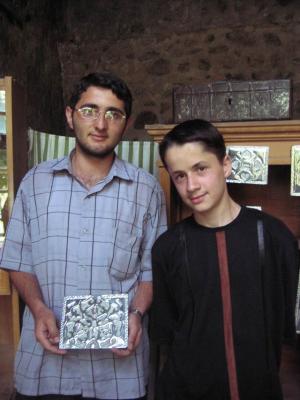 I bought this wall hanging, made by the man holding it.  That's Mohamed on the right, an English-speaking 15 year in Sheki.