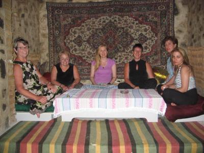 Jan, Christa, me, Margie, Ruhinguez and Gular curl up for tea and sweets in Sheki.