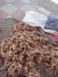 One of five big piles of raw wool on the front porch of the school.  This is the dowry for the directors daughter.