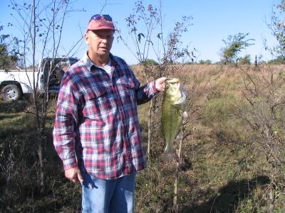 6 pound 23 inch large mouth bass caught on plastic worm in farm pond Oct 24,2005