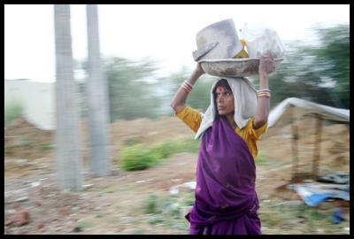Carrying the load of a growing city, construction worker, Gurgaon