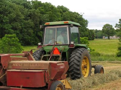 Baling hay with a  New Holland baler