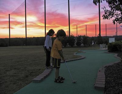 golfing in the sunset