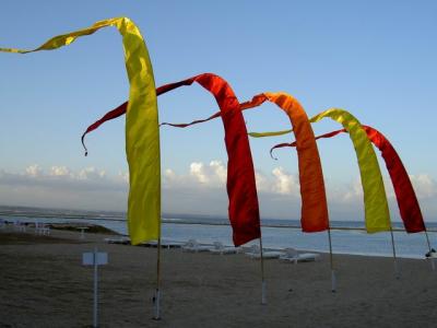 A 'Penjor' dances with the windy evening along Sanur Beach