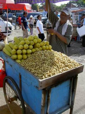 Balinese man selling groundnuts and sweet corn at Sukawati