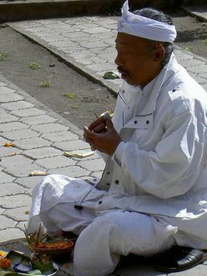 Hindu man deep in prayer at Pura Ulun Danu Batur