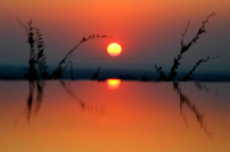 Victoria Falls - Sunset taken whilst standing in a very cold infinity pool