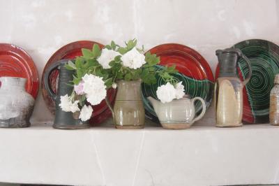 roses and  pottery in the kitchen