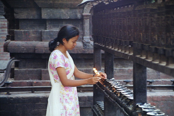 Woman Lighting Candles (Close Up)