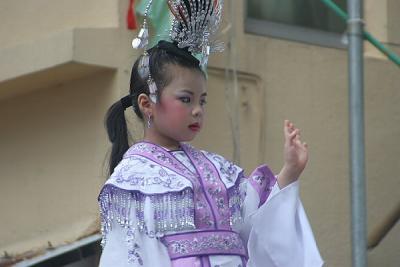 Child Dressed in Purple Traditional Dress (Closer)