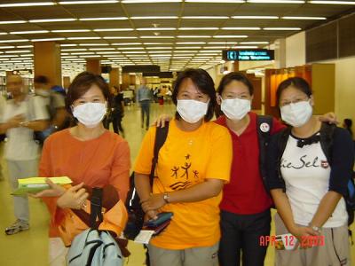 Ornprapid, Orakarn, Fair and Areeya in Mask at Bangkok Airport