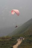 Pink Paraglider over trail