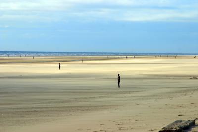 Bronze men on Crosby beach, looking North