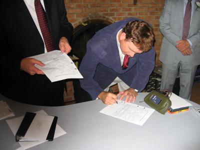 Mike signing the marriage license