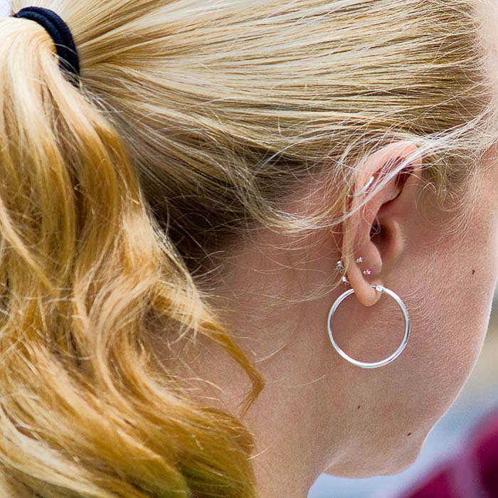 Girl with many earrings