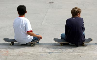 Two skateboarders resting