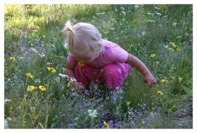 Emily smelling the flowers