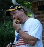 Patriotic American Man Consuming the Perfect American Hot Dog