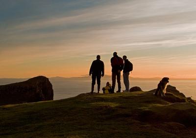 Talking while the sun sets at Neist Point