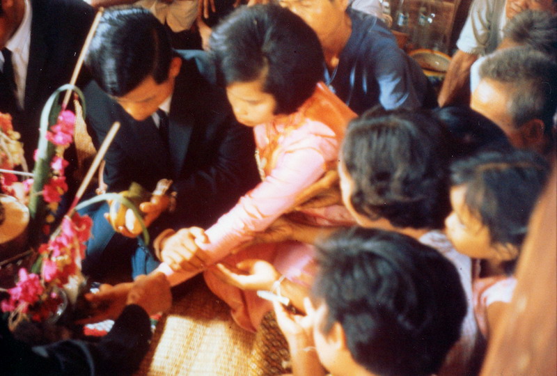 024 - Thai Wedding ceremony - The Bride and Groom tying strings on each others wrist