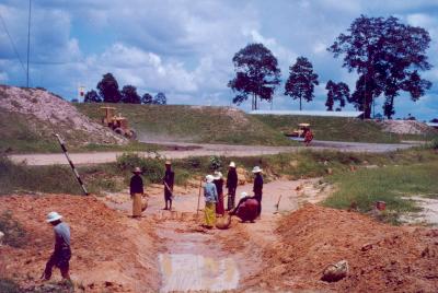 047 - Thai women digging ditch for water line at the bomb dump, near the 8th SPS K-9 section kennels