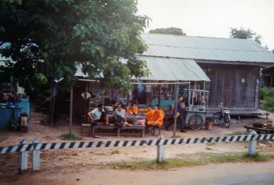 054 - Buddhist monks at a roadside eating establishment