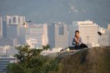 woman praying on Ingwansan Shamanist Hillside (James Hendrik)