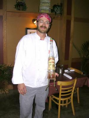 Minatori's chef displaying spigot bottle