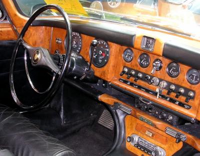 Jaguar dash  with lotsa metal gauges stuck in wood