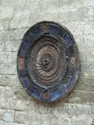 On the wall in courtyard - a french dinner plate!