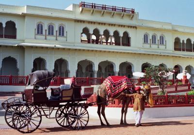 Camel-drawn coach outside Rambagh Palace