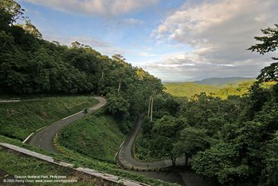 SWEET LIGHT, SPECTACULAR PLACE - This is an early morning view from the top of Bitukang Manok
(literally chicken intestines), the winding road leading to the highest highway point
of Quezon National Park.

[20D + Sigma 10-20, hand held]