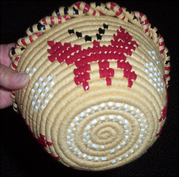 Beading (white decoration and top rim) is a weaving technique used in coiled baskets.