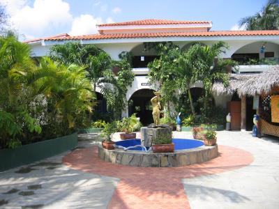 At the front gate of the hotel, looking into the hotel