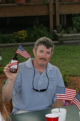 Steve with his american flag in a jamaican beer...